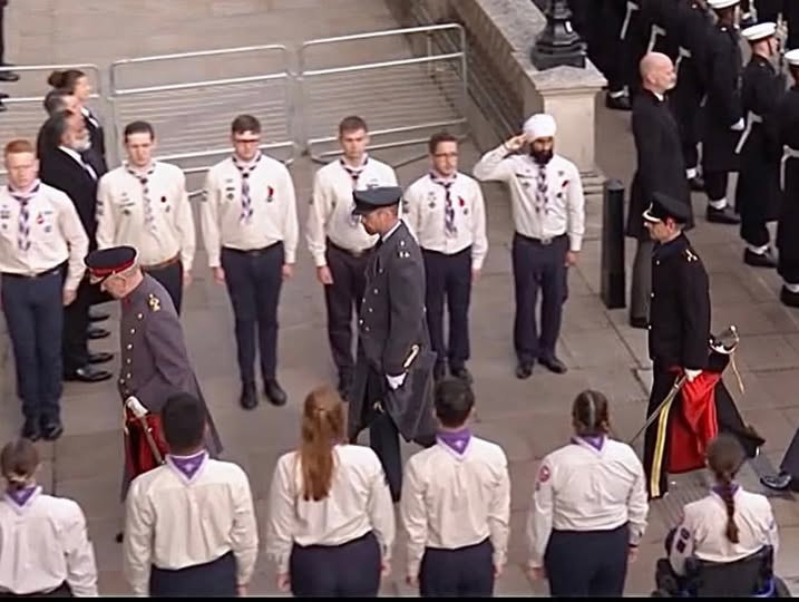 Ganga pictured saluting HM The King
